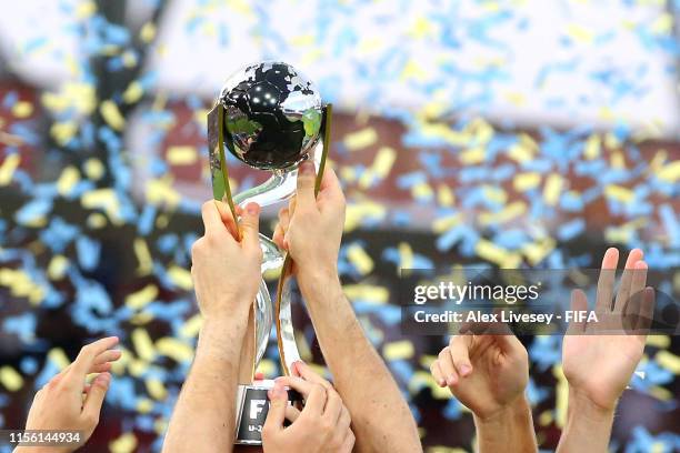 Valerii Bronda of Ukraine amd his team mates celebrate with the FIFA U-20 World Cup Trophy following his team's victory in the 2019 FIFA U-20 World...