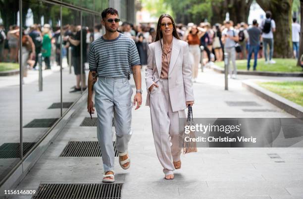 Couple Jean-Sebastian Rocques and Alice Barbier seen outside Emporio Armani during the Milan Men's Fashion Week Spring/Summer 2020 on June 15, 2019...