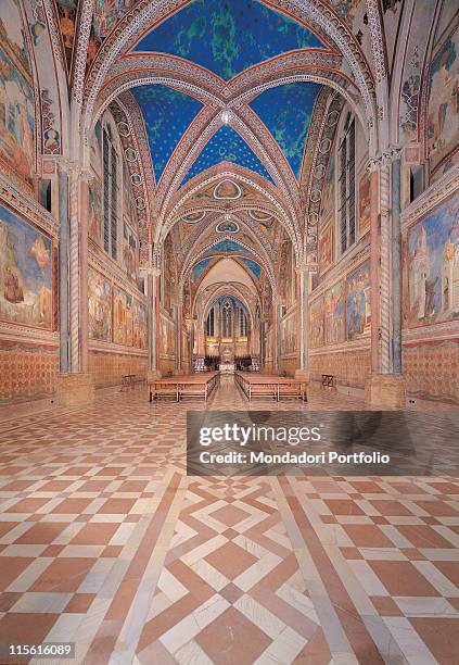 Italy; Umbria; Perugia; Assisi; San Francesco Upper Basilica. Axial view nave ribbed cross vaults inlaid marble floor