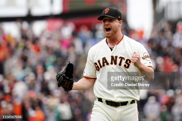 Will Smith of the San Francisco Giants celebrates beating the Milwaukee Brewers and getting the save at Oracle Park on June 15, 2019 in San...