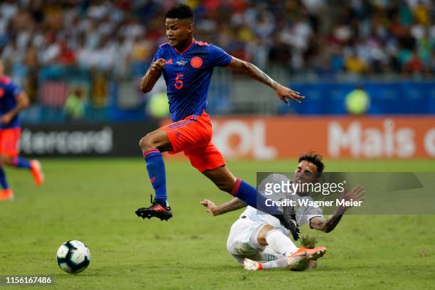 Wílmar Barrios of Colombia kicks the ball against Renzo Saravia of Argentina during the Copa America Brazil 2019 group B match between Argentina and...
