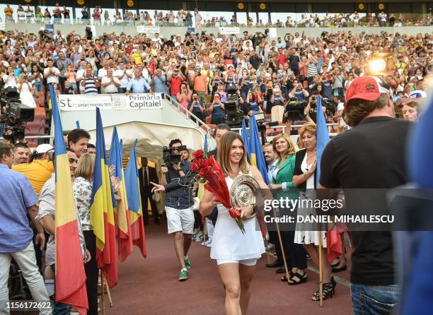 Romanian tennis player Simona Halep, winner of Wimbledon WTA Tournament arrives with the trophy at a special ceremony for her fans gathered at the...