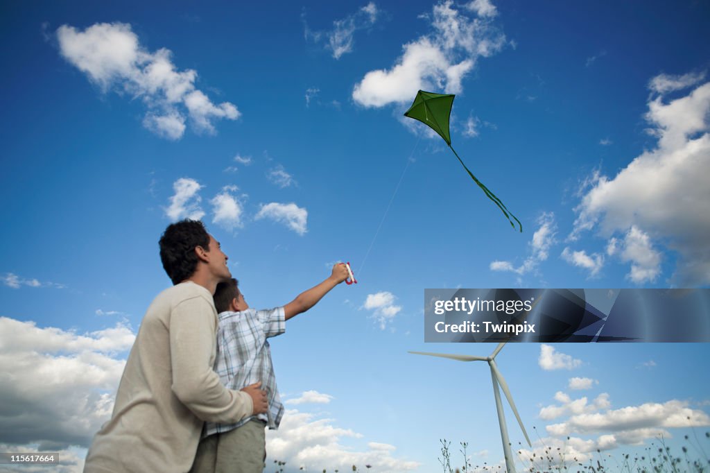 Father and son flying a kite