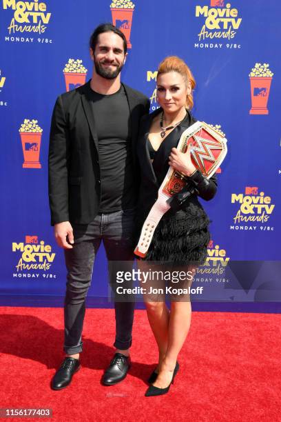 Seth Rollins and Becky Lynch attends the 2019 MTV Movie and TV Awards at Barker Hangar on June 15, 2019 in Santa Monica, California.