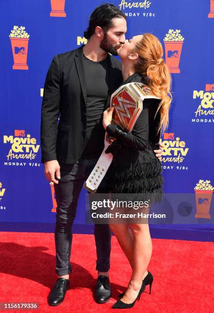 Seth Rollins and Becky Lynch attend the 2019 MTV Movie and TV Awards at Barker Hangar on June 15, 2019 in Santa Monica, California.