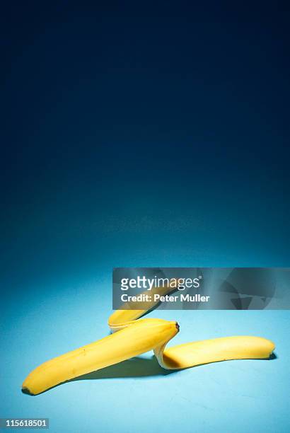 banana skin on ground - banana skin stock-fotos und bilder