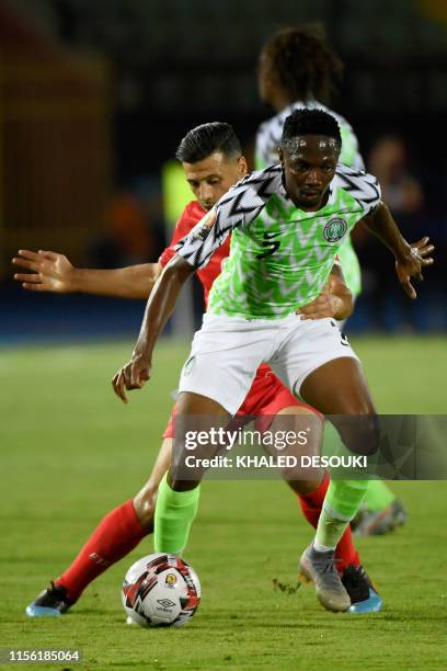 Tunisia's forward Anice Badri fights for the ball with Nigeria's forward Ahmed Musa during the 2019 Africa Cup of Nations third place play-off...