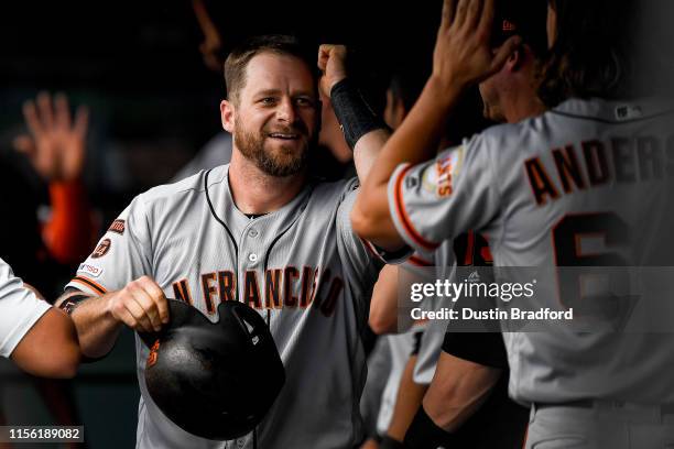 Stephen Vogt of the San Francisco Giants celebrates a fifth inning 2-run homer against the Colorado Rockies at Coors Field on July 17, 2019 in...