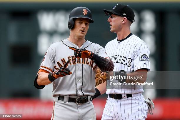 Mike Yastrzemski of the San Francisco Giants celebrates after reaching second base on a fifth inning double against the Colorado Rockies at Coors...