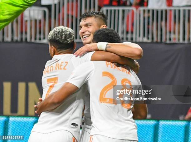 Atlanta's Josef Martinez and Dion Pereira hug Brandon Vazquez after he scored a goal during the MLS match between Houston Dynamo and Atlanta United...