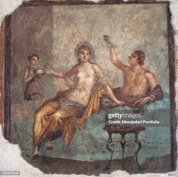 Italy; Campania; Naples; National Archaeological Museum; inv. 9024. Da Ercolano. Whole artwork. Couple man woman veil nudity glass ryton hetaera table