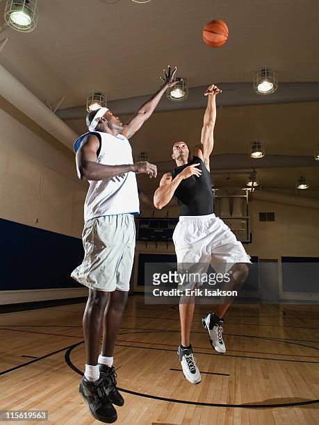 men playing basketball on basketball court - blocking sports activity stock pictures, royalty-free photos & images