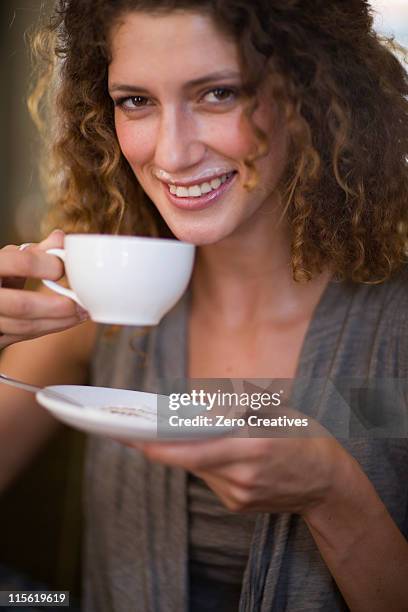 woman dinking a cup of coffee - milk moustache stock pictures, royalty-free photos & images