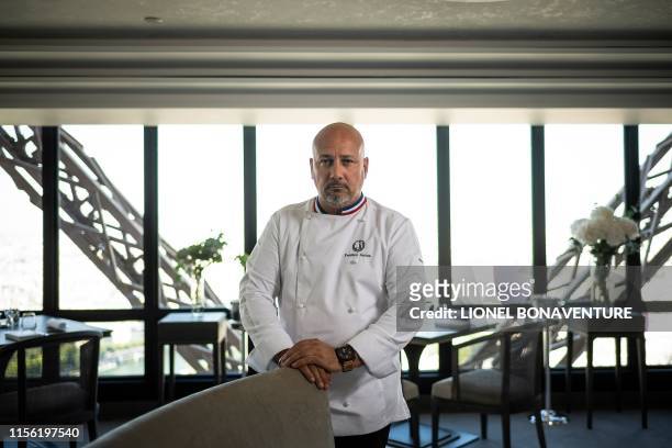 Starred French chef Frederic Anton poses during a photo session at the "Le Jules Verne" restaurant at the Effeil Tower in Paris on July 15, 2019. -...