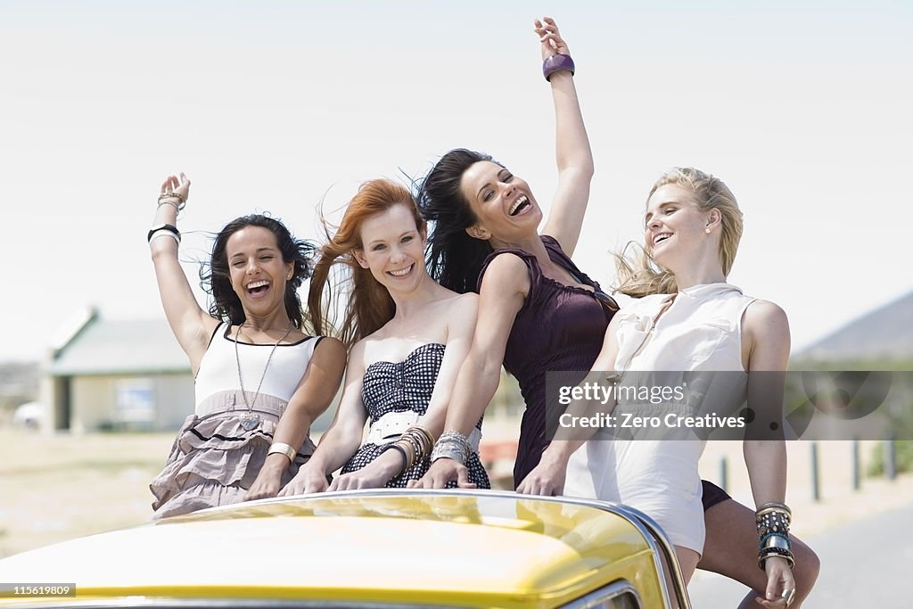 4 Girl friends on back of pickup fun