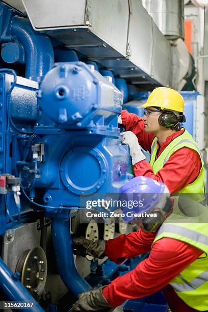 men doing maintenance works - boat engine stock pictures, royalty-free photos & images