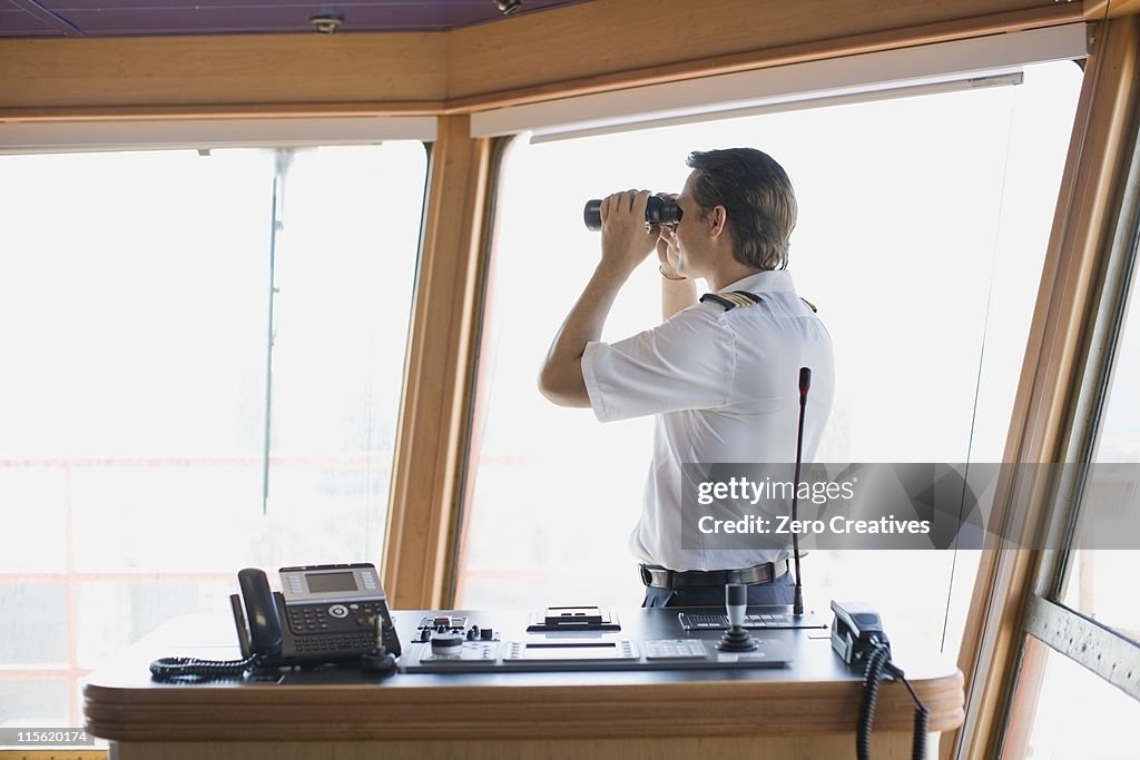 Officer looking through binoculars