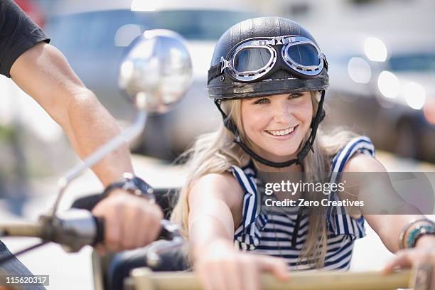 woman on a motorbike - vintage motorcycle helmet stock pictures, royalty-free photos & images