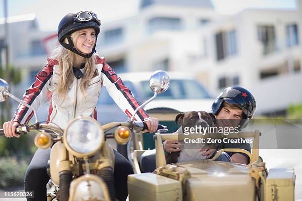 couple riding a motorbike - motorbike sidecar stock pictures, royalty-free photos & images