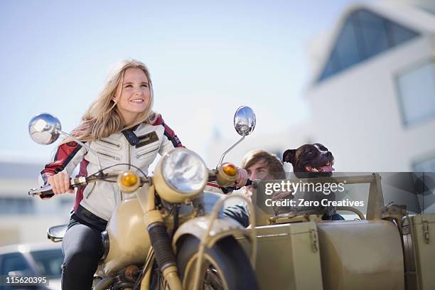 couple with dog riding a motorbike - motorbike sidecar stock pictures, royalty-free photos & images