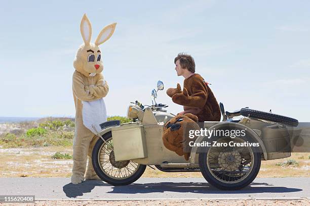 disguised couple on motorbike - moto humour photos et images de collection