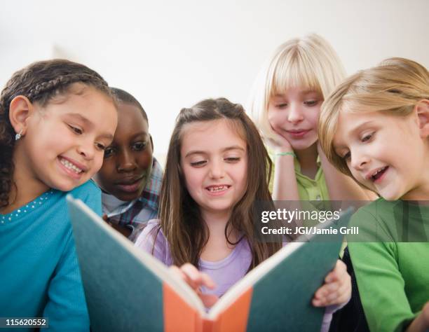 Sharing Books 3,305 Children Sharing Book Stock Photos, High-Res Pictures, and Images ...
