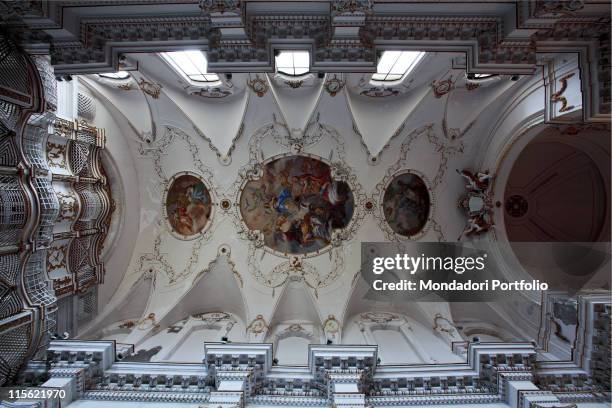 Italy; Sicily; Syracuse; Syracuse; Santa Maria della Concezione Church. Detail. Ceiling with frescoes. Stuccoes fresco white gold capitals decoration...