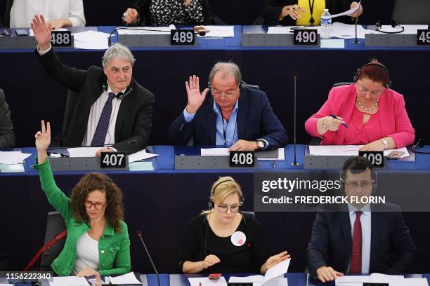 Renew Europe Group British MPE Phil Bennion and European People's Party group Romanian MEP Vasile Blaga take part in a voting session during a...