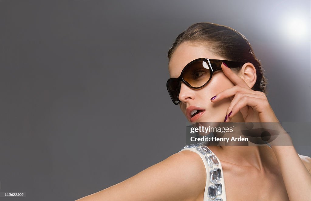 Fashion model in glasses looking off camera