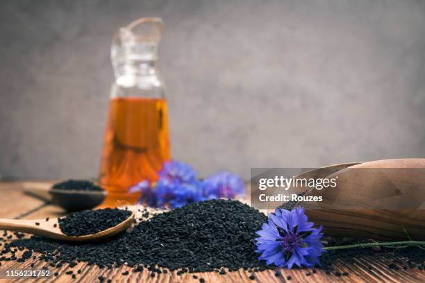 nigella sativa oil - nigella stock pictures, royalty-free photos & images