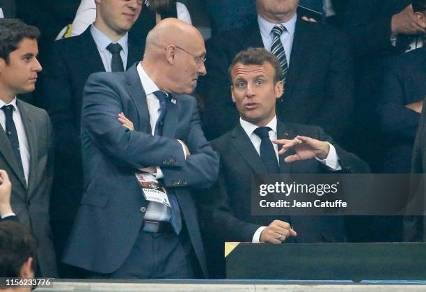 President of French Rugby Federation FFR Bernard Laporte chats with President of France Emmanuel Macron during the trophy ceremony following the Top...