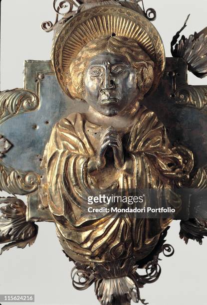 Italy, Lombardy, Bergamo, Carmine Church. Detail. Astylar cross jewelry praying figure imation mantle; cloak acanthus leaves gold silver.