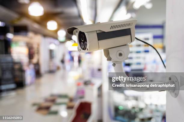 cctv security guard in the mall building. - caméra de surveillance photos et images de collection