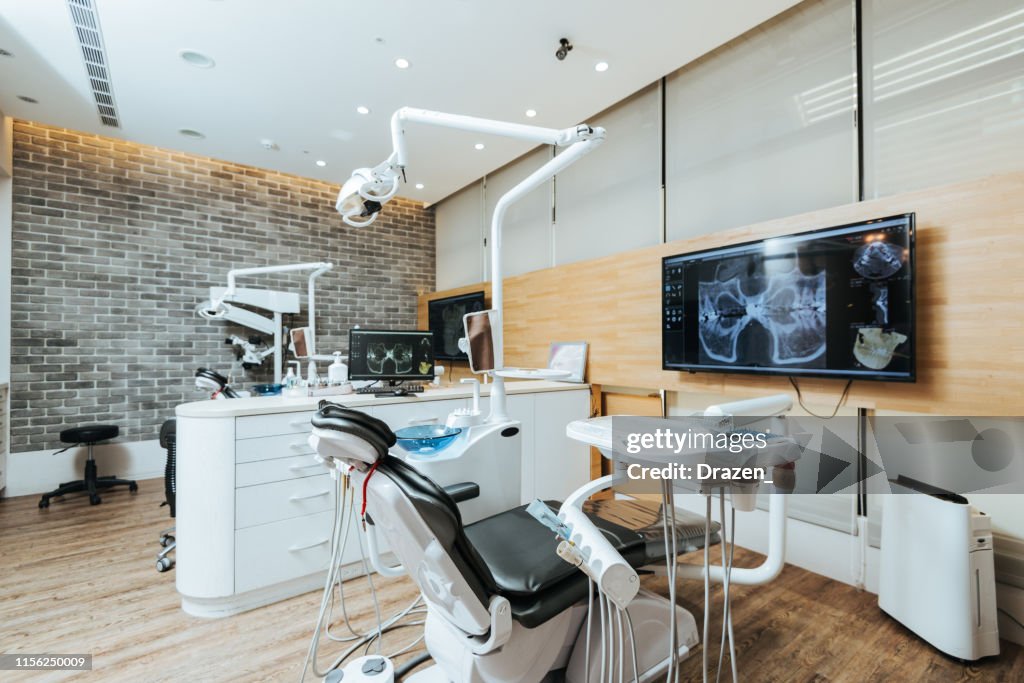 Dentist office with modern equipment and microscope