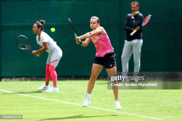 Ashleigh Barty of Australia and Heather Watson of Great Britain during a practice session on day two of qualifying for the Nature Valley Classic at...