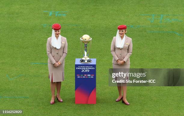 The trophy and Emirates ladies look on before the Group Stage match of the ICC Cricket World Cup 2019 between India and Pakistan at Old Trafford on...