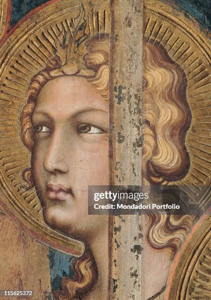 Italy, Tuscany, Siena, Palazzo Pubblico, Sala del Mappamondo. Detail. Face of an angel halo; aureole rays hairstyle hairband jewel crown gold leaf...