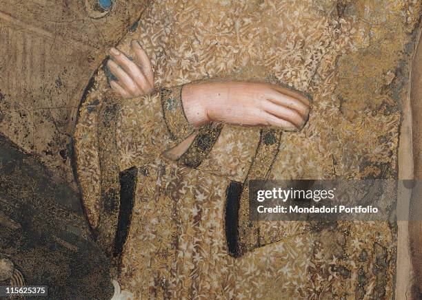 Italy, Tuscany, Siena, Palazzo Pubblico, Sala del Mappamondo. Detail. The folded arms of St Catherine of Alexandria dress; garment gold pink red...