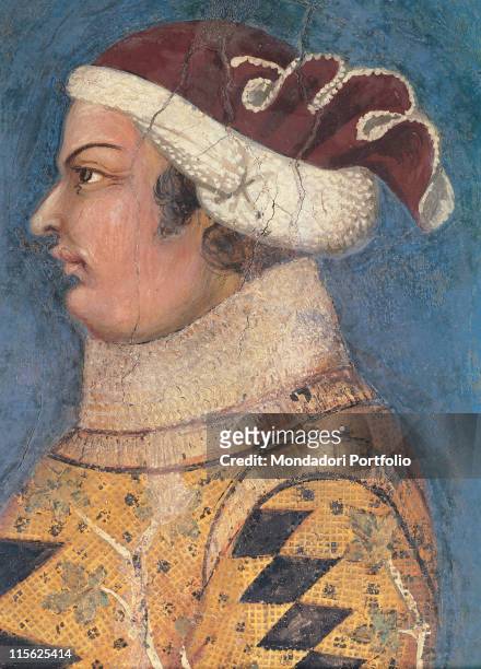 Italy, Tuscany, Siena, Palazzo Pubblico, Sala del Mappamondo. Detail of face of Guidoriccio from Fogliano, headgear jacket profile rhombs yellow...
