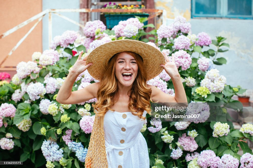 Beautiful girl with Hydrangea flowers