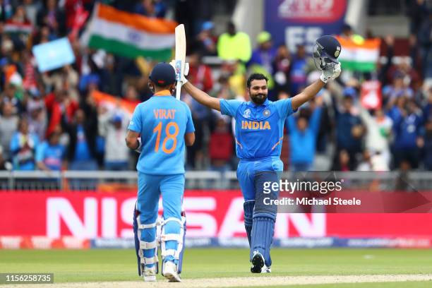 Rohit Sharma of India celebrates reaching his century with captain Virat Kohli during the Group Stage match of the ICC Cricket World Cup 2019 between...