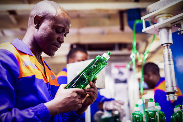 production line workers at a factory in africa checking the quality of the product