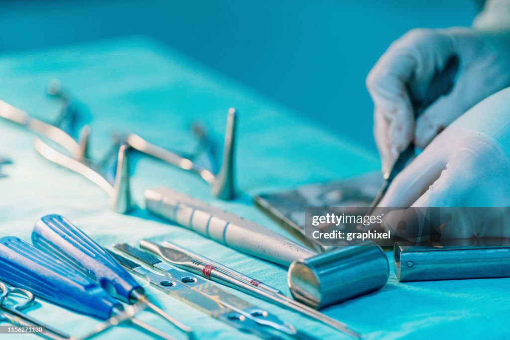Surgeon Cutting Cartilages Section During Rhinoplasty Surgery