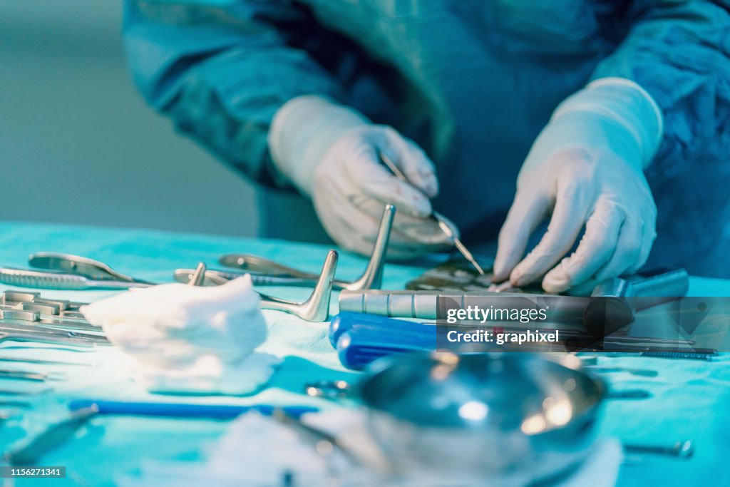 Surgeon Cutting Cartilages Section During Rhinoplasty Surgery