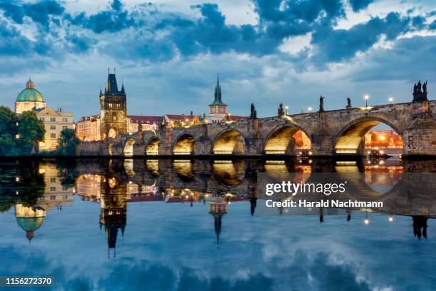 old town with charles bridge, bridge tower and vltava river, prague, bohemia, czech republic - praga fotografías e imágenes de stock