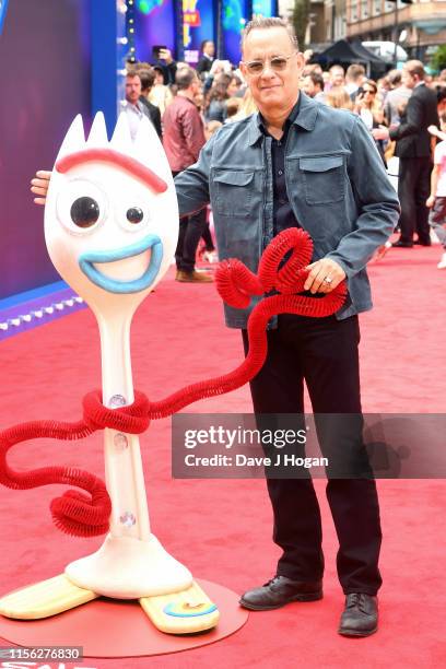 Tom Hanks signs autographs as he attends the "Toy Story 4" European Premiere at Odeon Luxe Leicester Square on June 16, 2019 in London, England.