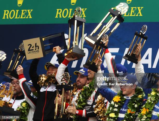 The Toyota Gazoo Racing TS050 Hybrid of Fernando Alonso, Sebastien Buemi and Kazuki Nakajima celebrate winning the Le Mans 24 Hour Race at the...