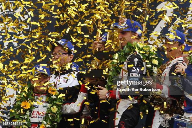 The Toyota Gazoo Racing TS050 Hybrid of Fernando Alonso, Sebastien Buemi and Kazuki Nakajima celebrate winning the Le Mans 24 Hour Race at the...