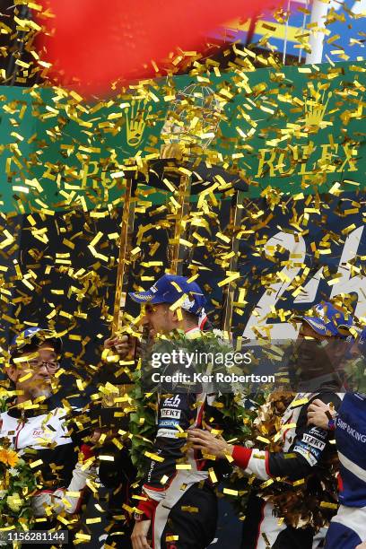 The Toyota Gazoo Racing TS050 Hybrid of Fernando Alonso, Sebastien Buemi and Kazuki Nakajima celebrate winning the Le Mans 24 Hour Race at the...