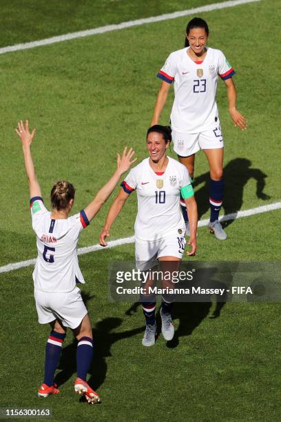 Carli Lloyd of the USA celebrates with teammate Morgan Brian after scoring her team's third goal during the 2019 FIFA Women's World Cup France group...